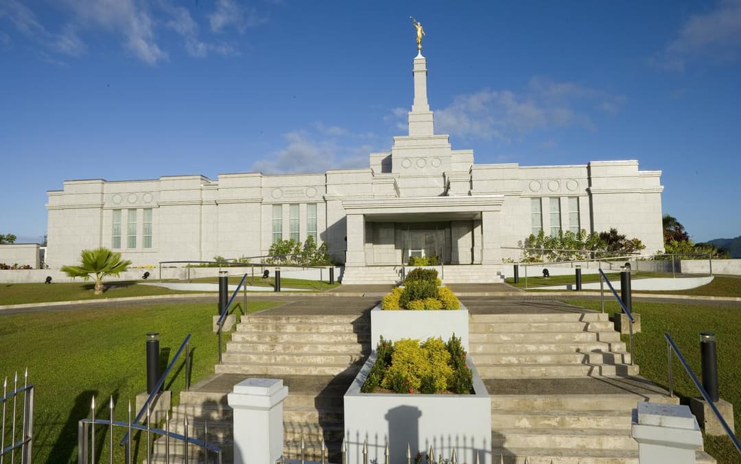 Front entrance and spire of the Suva Fiji Temple in daylight.