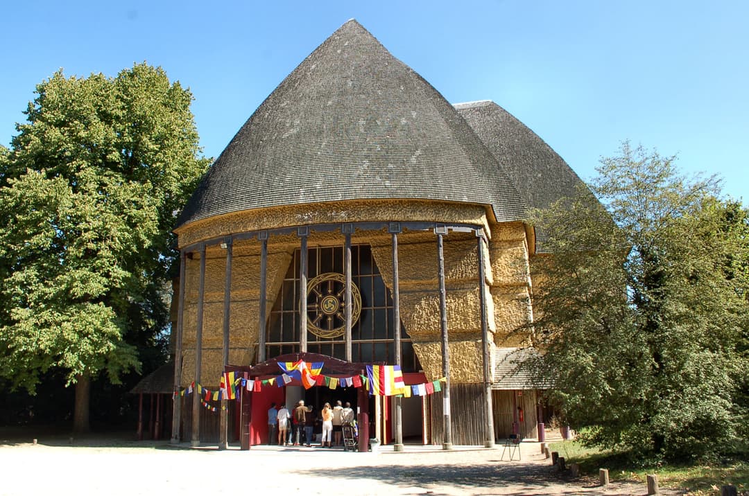 Front entrance of the Grande Pagode de Vincennes with Buddhist flags