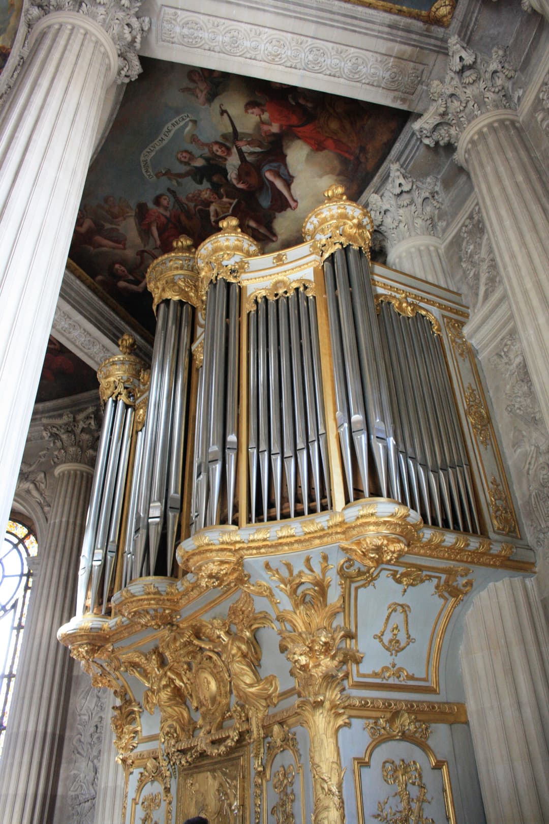 The ornate gilded pipe organ inside the Royal Chapel of Versailles.
