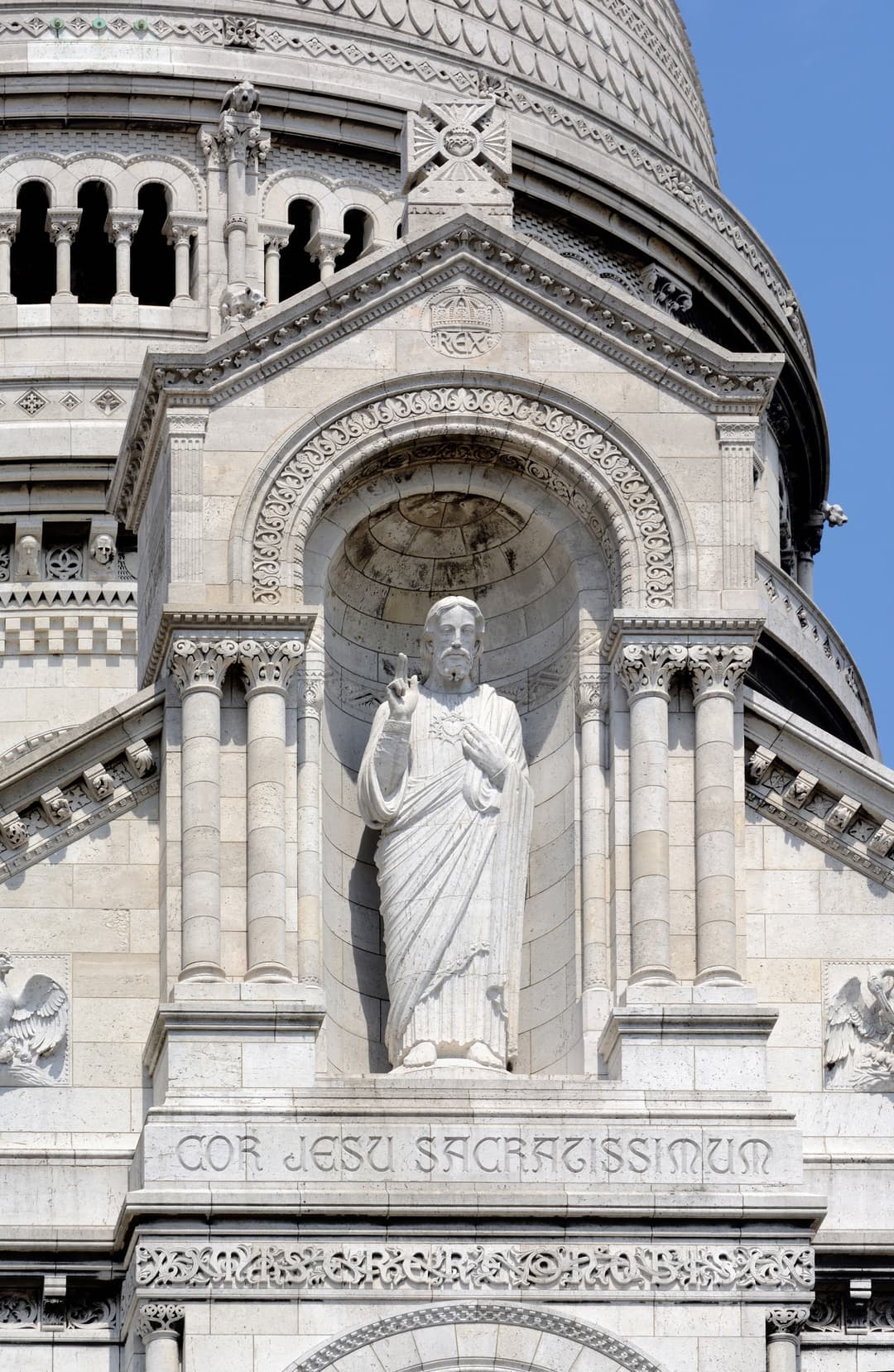Detail of the statue of Christ on the exterior façade of Sacré-Cœur, Paris.