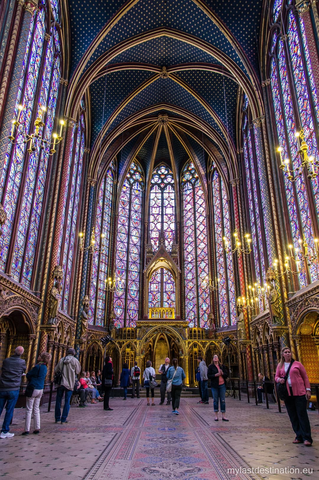 Interior view of the Upper Chapel at Sainte-Chapelle with stained glass.