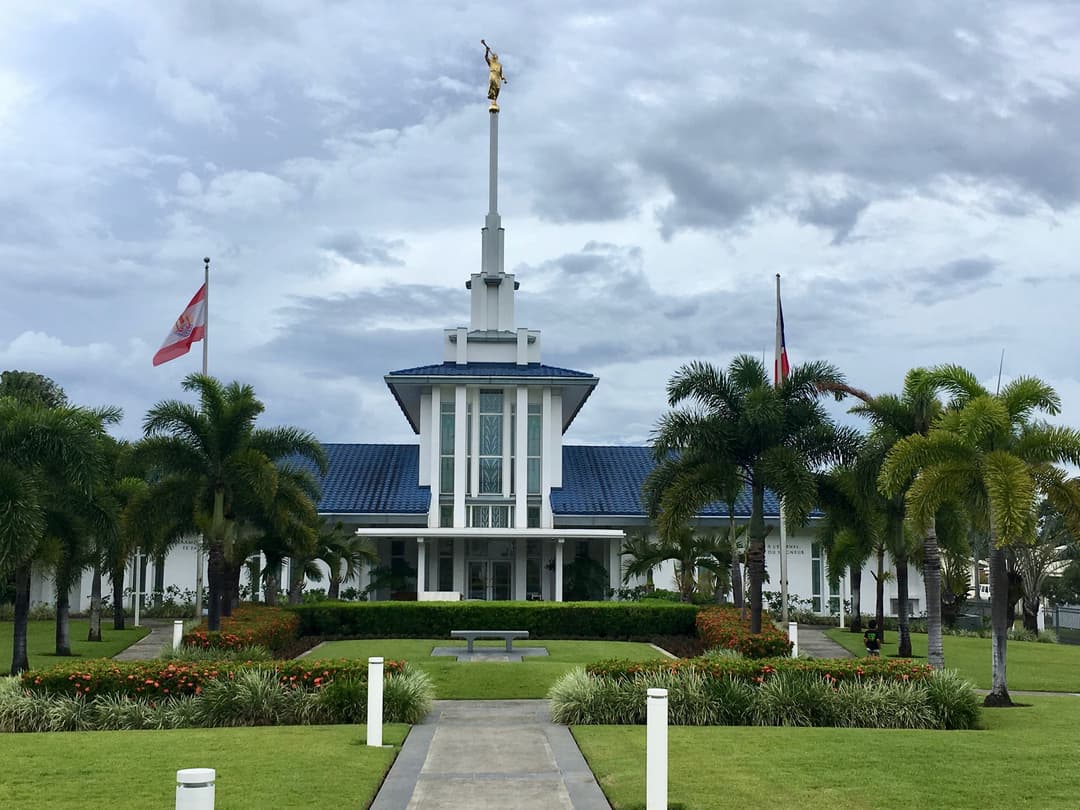 Papeete Tahiti Temple, front exterior view on overcast day. Spire with Angel Moroni.