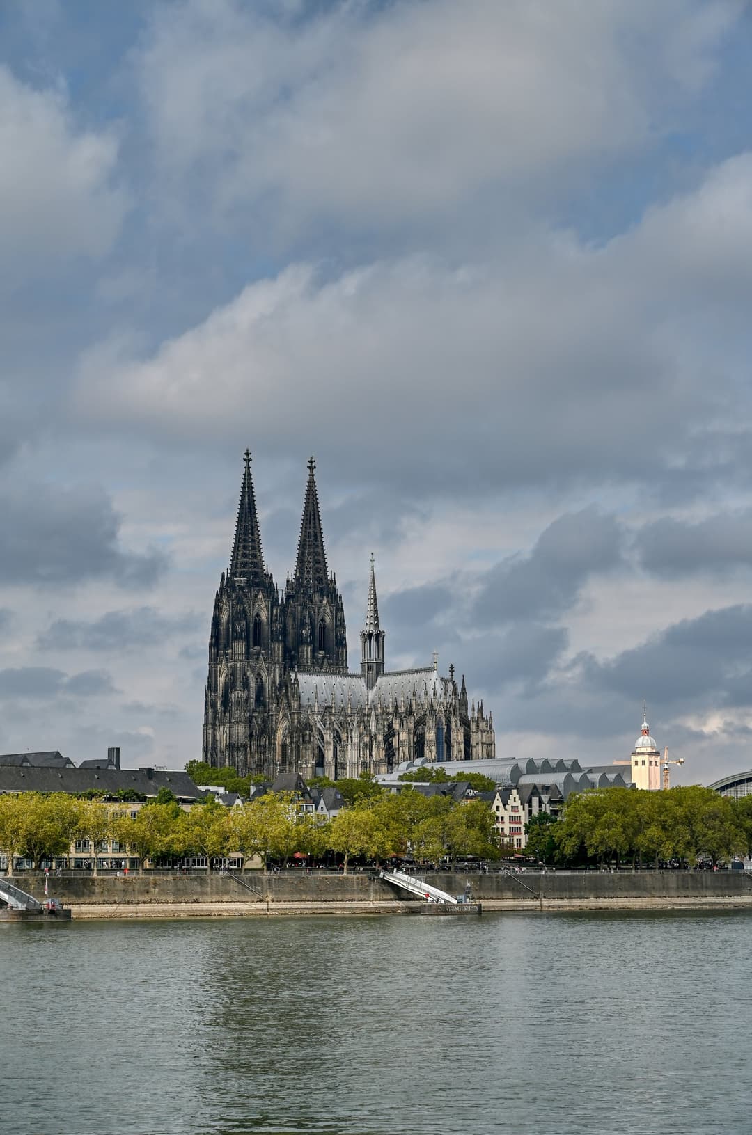 Cologne Cathedral and its twin spires viewed across the Rhine River