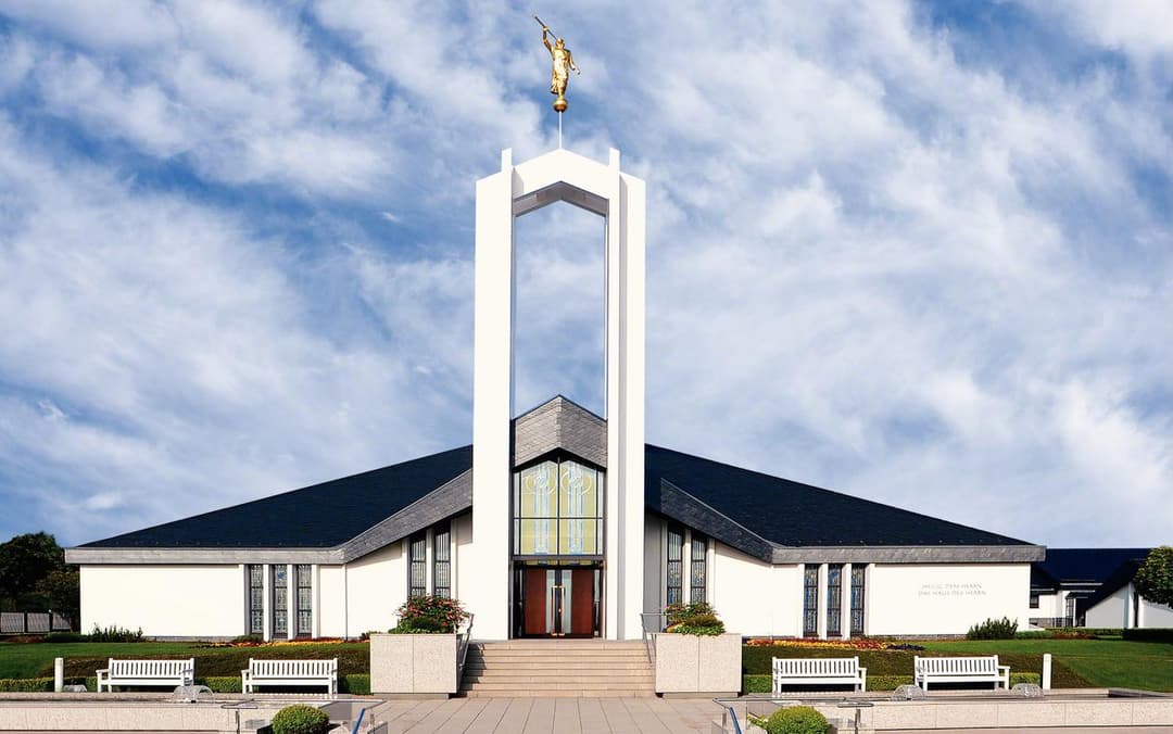 A serene view of the temple reflecting in the water.