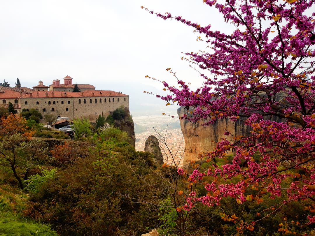 Monastery of St. Stephen framed by blooming pink Judas tree branches