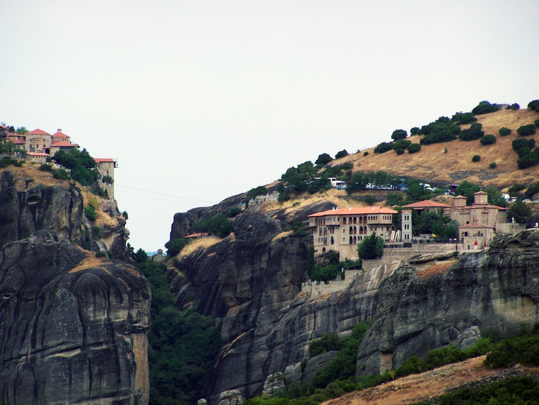 Distant view of the Monastery of Varlaam perched on Meteora cliffs.