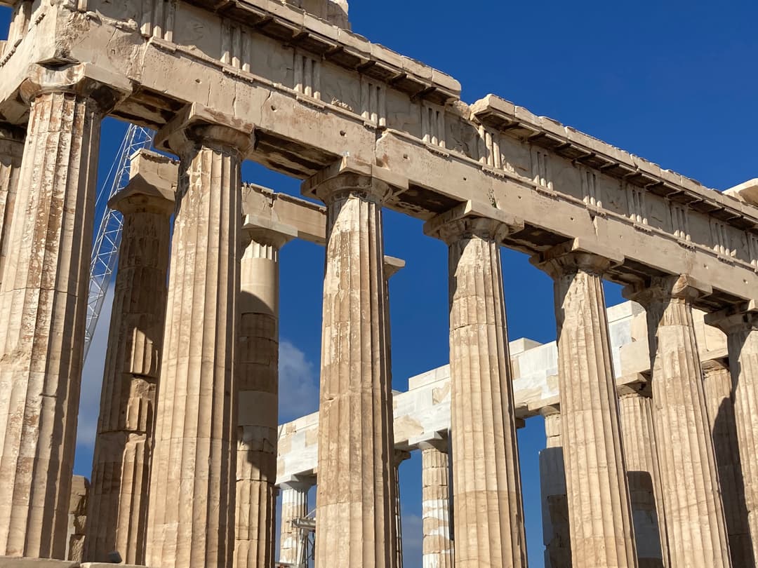 Low-angle view of the Parthenon's fluted Doric columns and entablature