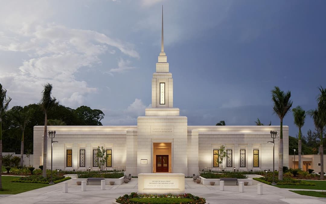 Front view of the illuminated Port-au-Prince Haiti Temple at dusk.