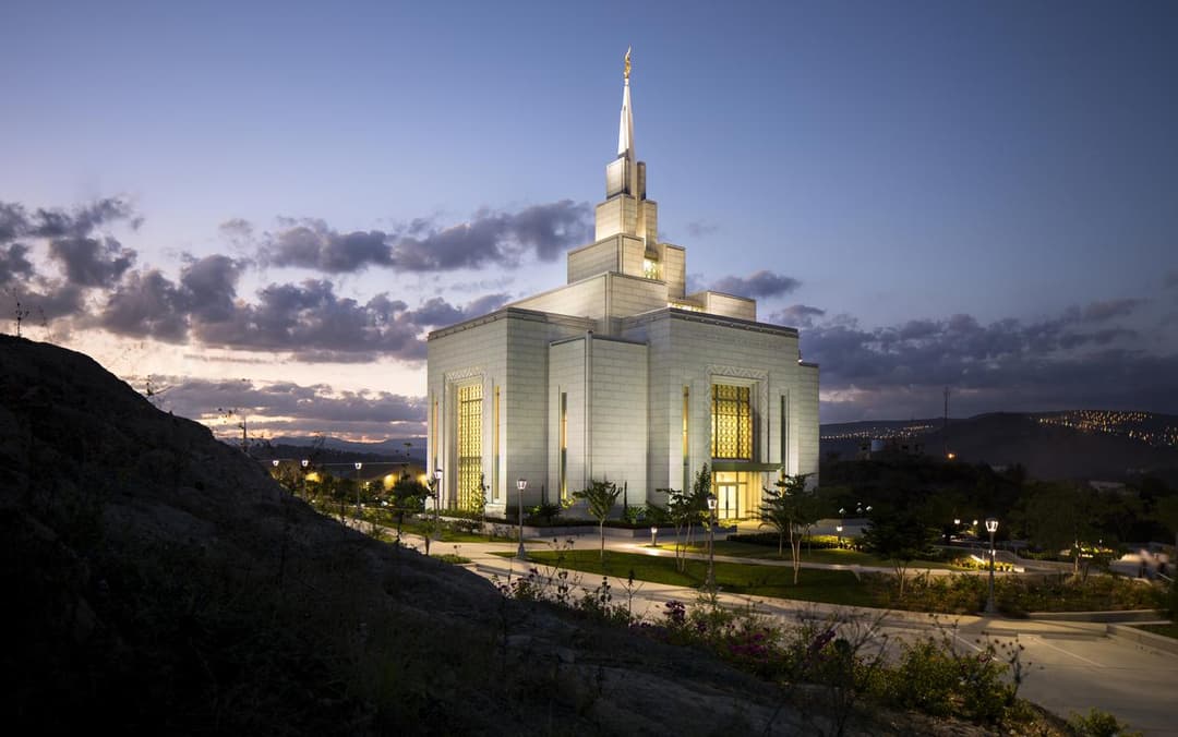 Exterior view of the Tegucigalpa Honduras Temple and spire at twilight.