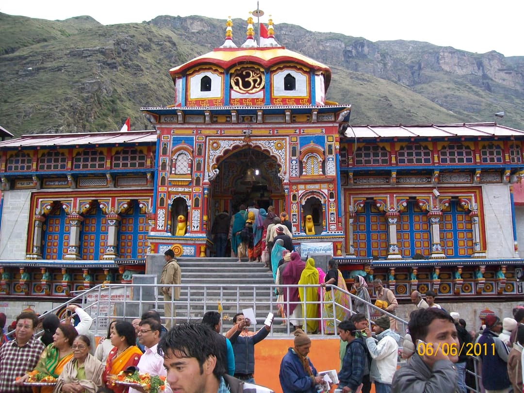 Pilgrims queuing at the colorful front entrance of Badrinath Temple