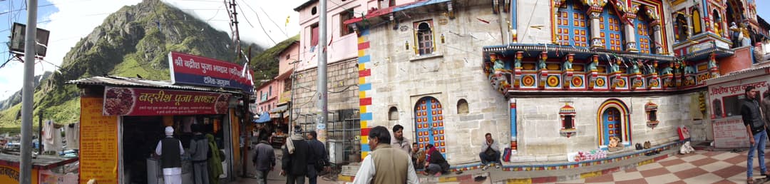 Panoramic view of Badrinath Temple facade, courtyard, and shops