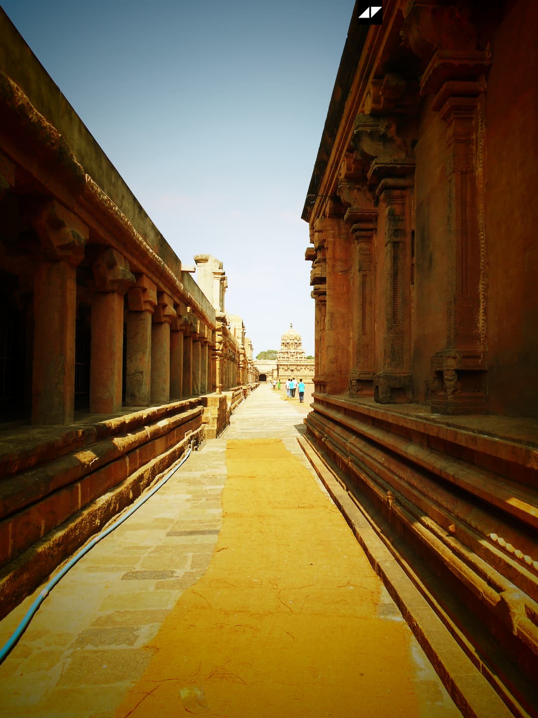 Stone walkway along the pillared cloister of the temple complex.
