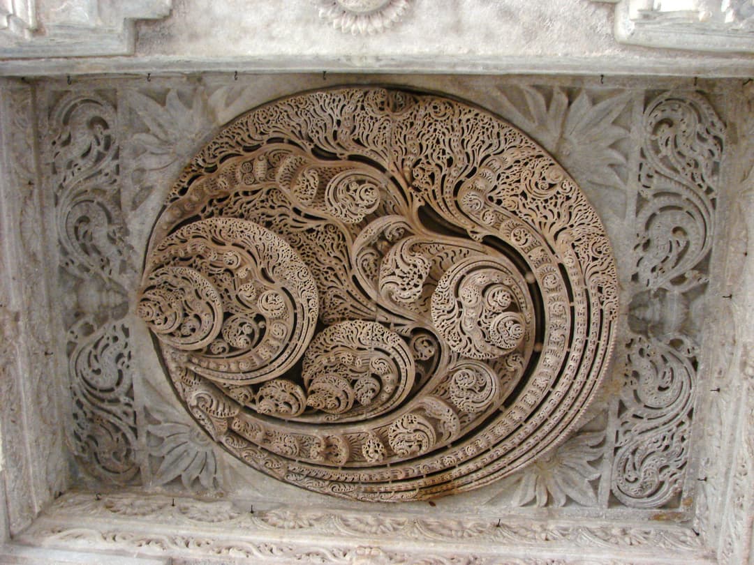 Intricate carved marble ceiling medallion at Dilwara Temples
