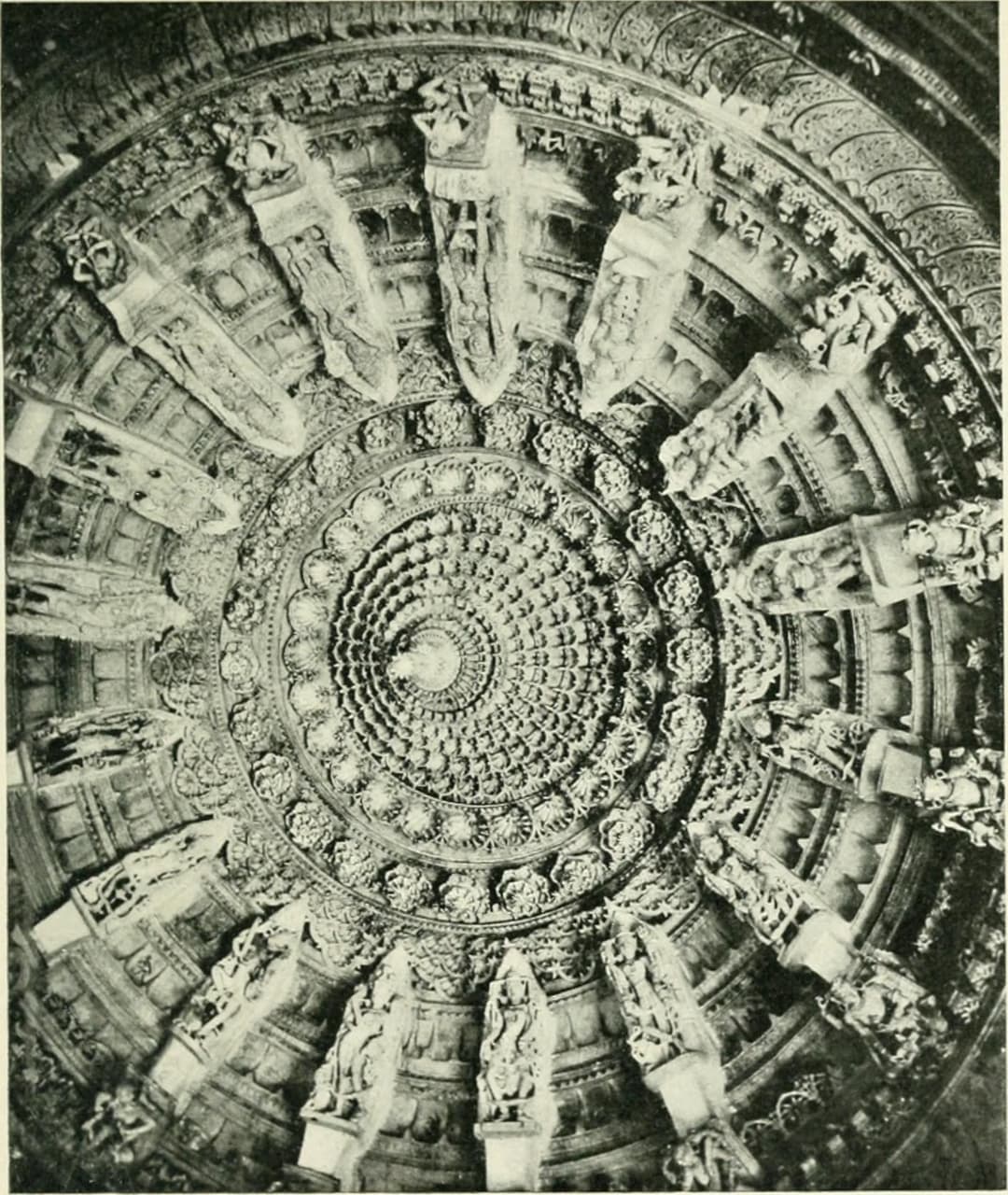 Intricately carved marble dome ceiling with radiating bracket figures