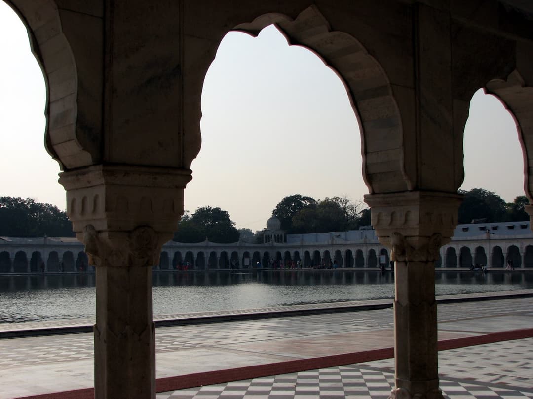 View of Sarovar through colonnade arches.