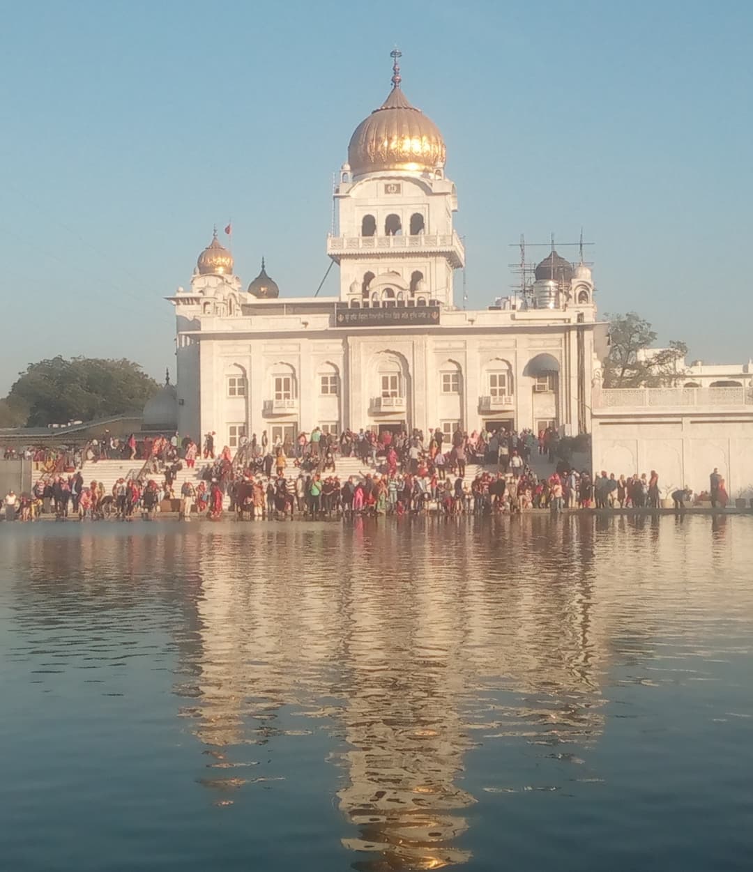 Gurdwara Bangla Sahib exterior view across the Sarovar (holy pool).