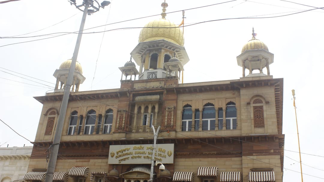 Gurudwara Sis Ganj Sahib facade, showing gilded domes.