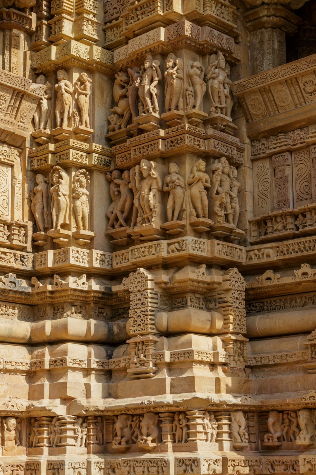 Detail of sculpted sandstone friezes on the temple exterior wall.