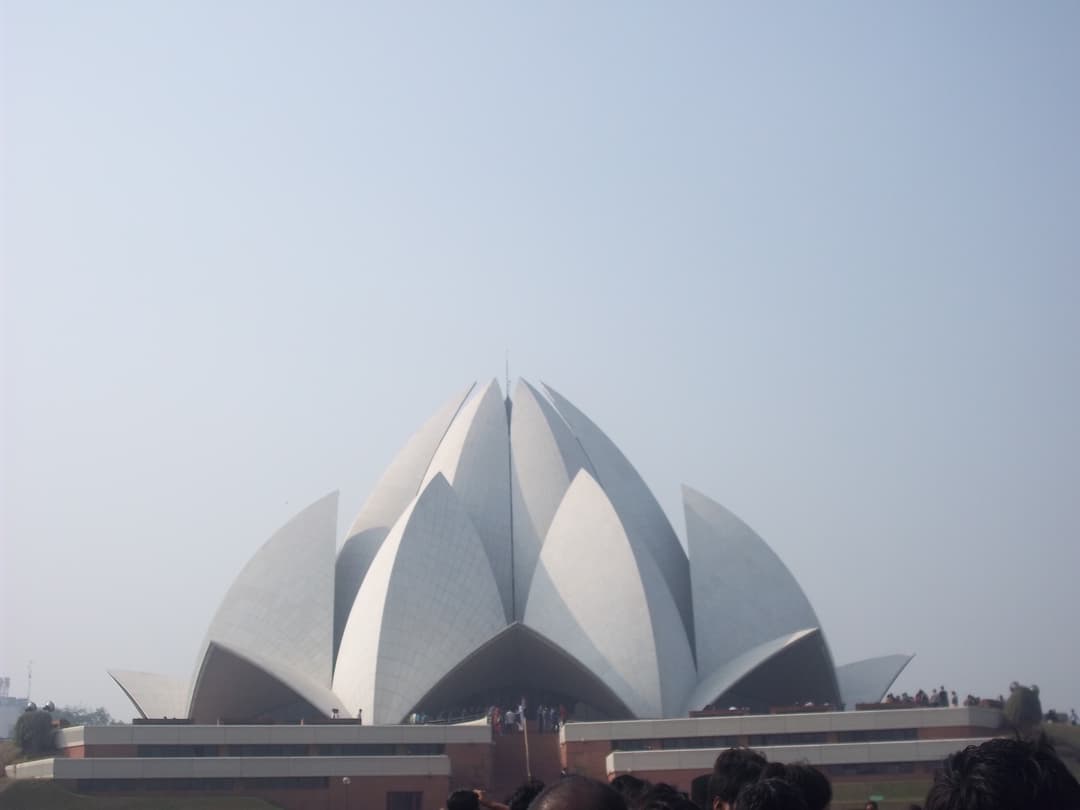 Front exterior view of the Lotus Temple and entrance podium.
