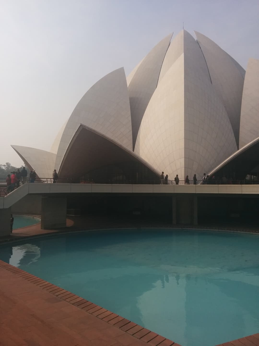 White marble petals of the Lotus Temple above the surrounding pool