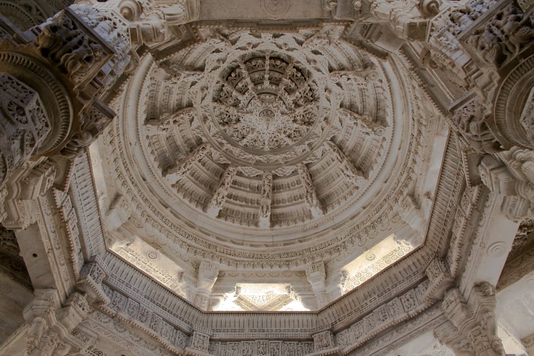 Intricately carved marble corbelled dome ceiling interior