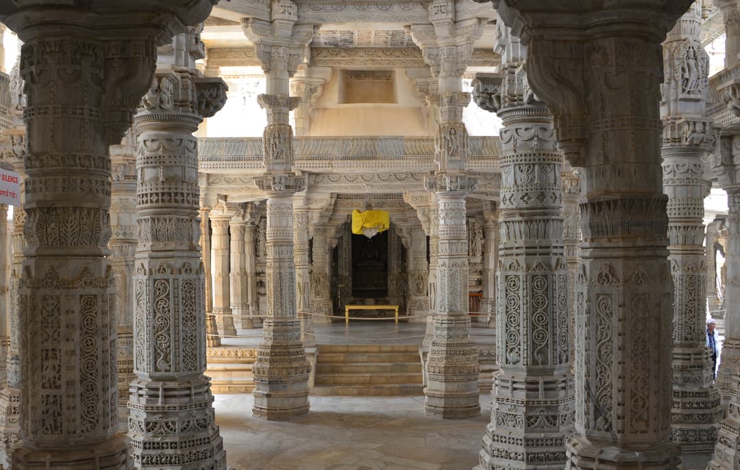 Intricately carved marble pillars leading to the inner sanctum