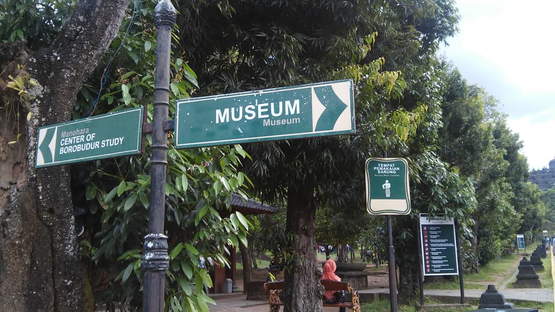 Directional signs on the grounds of Borobudur temple park.