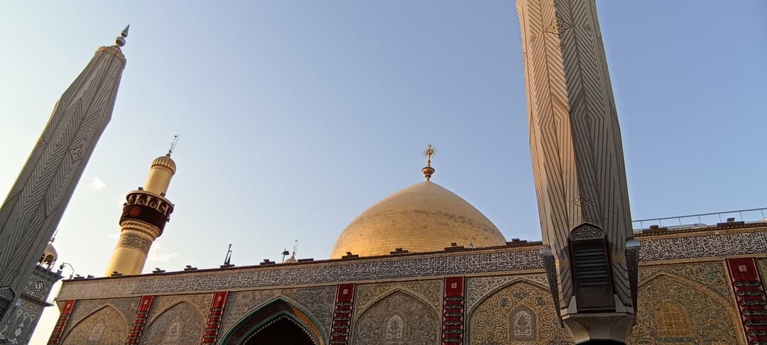 Visitors praying inside the Imam Ali Shrine.