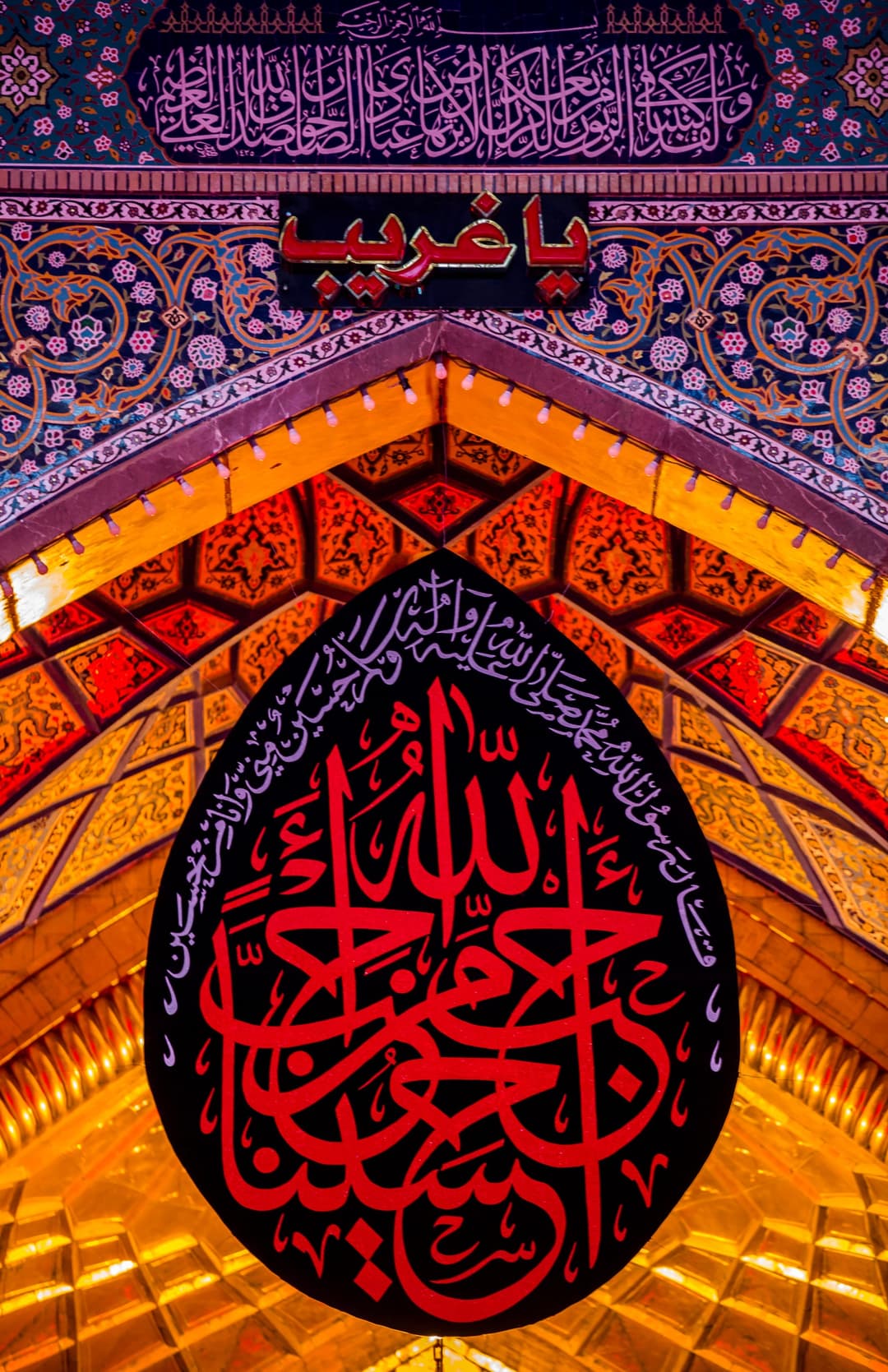 The shrine illuminated at night, a symbol of devotion.