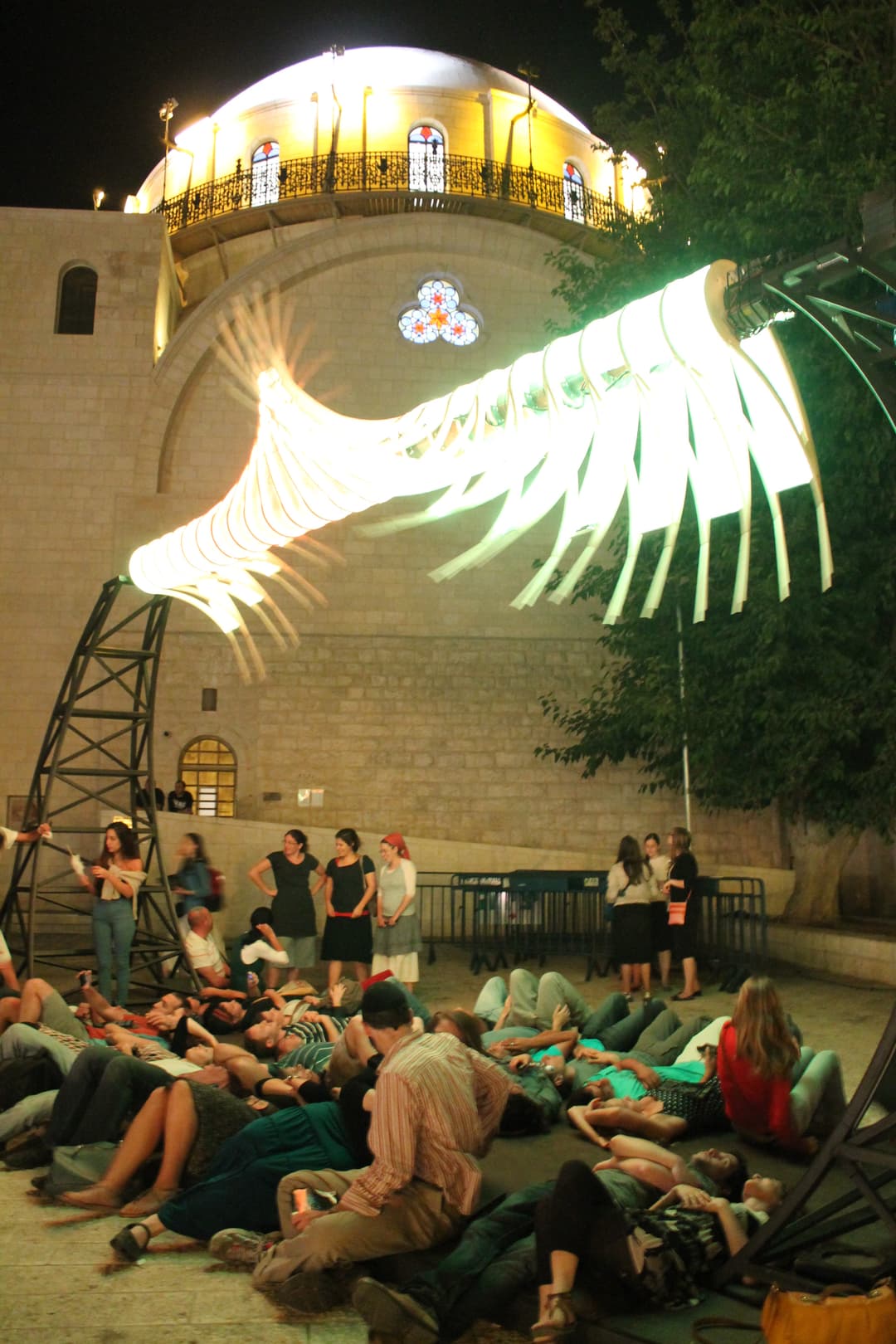 The interior of the synagogue, featuring crystal chandeliers and intricate details.