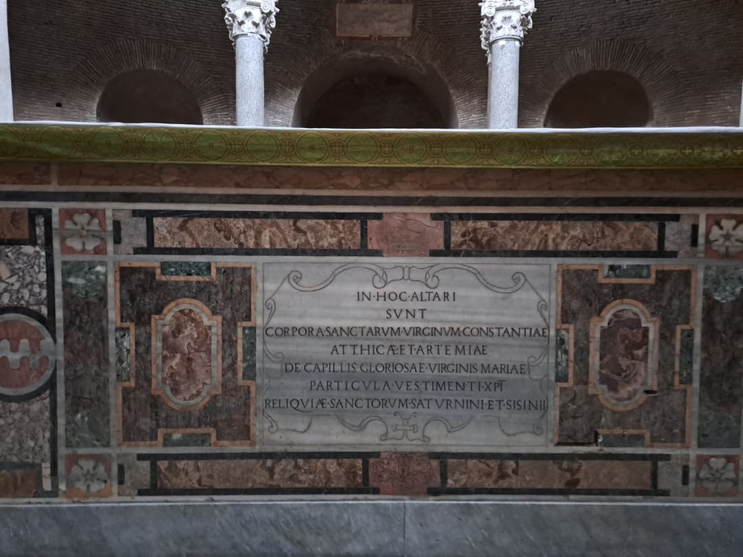 Marble altar with Latin relic inscription inside Santa Costanza.