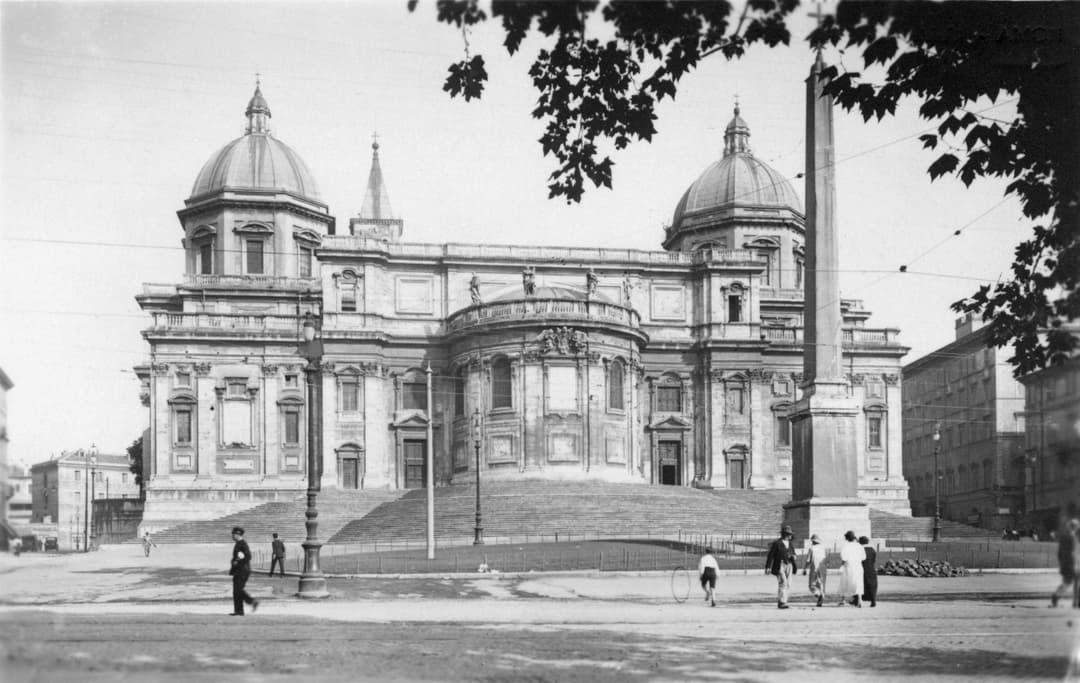 Exterior view of the apse, twin domes, and obelisk of Santa Maria Maggiore.