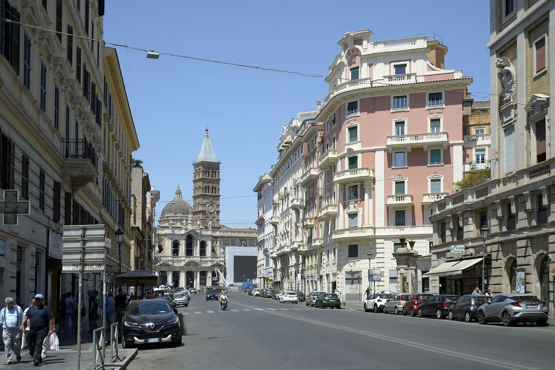 Street view towards the bell tower and dome of Santa Maria Maggiore.
