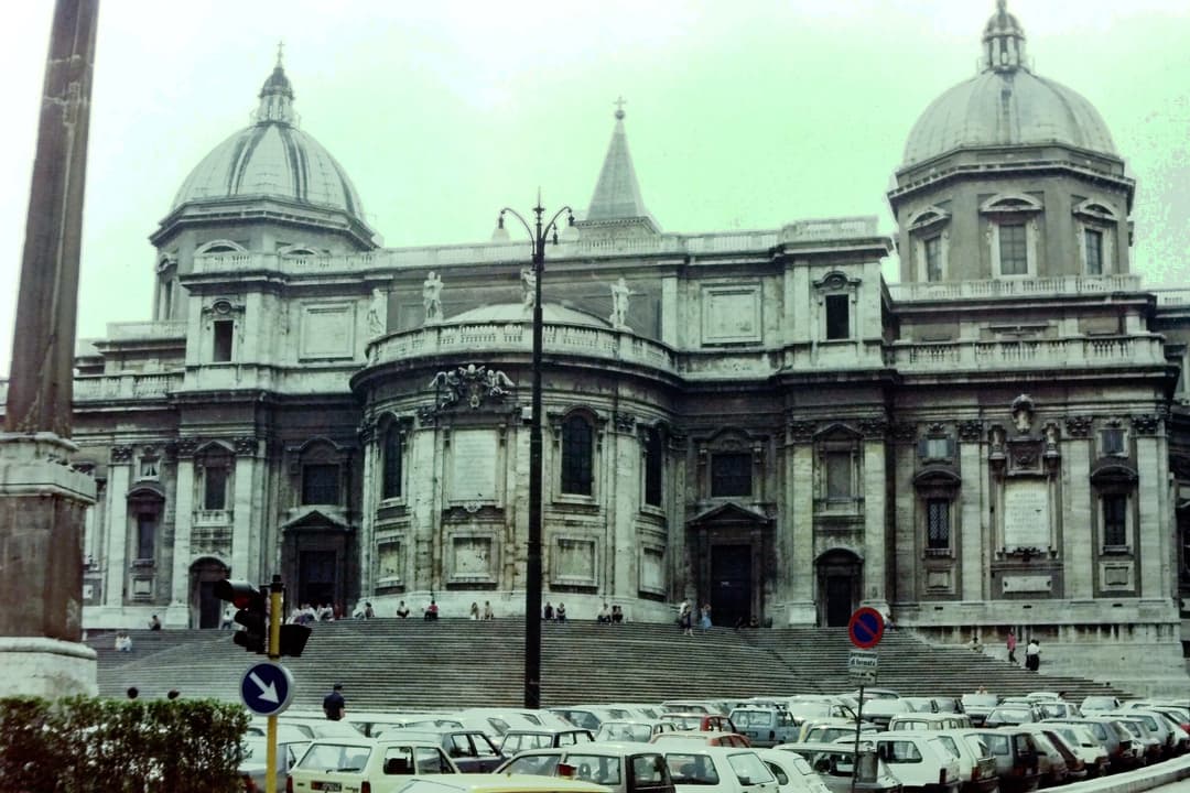 Rear facade of Santa Maria Maggiore with twin domes and Esquiline Obelisk.