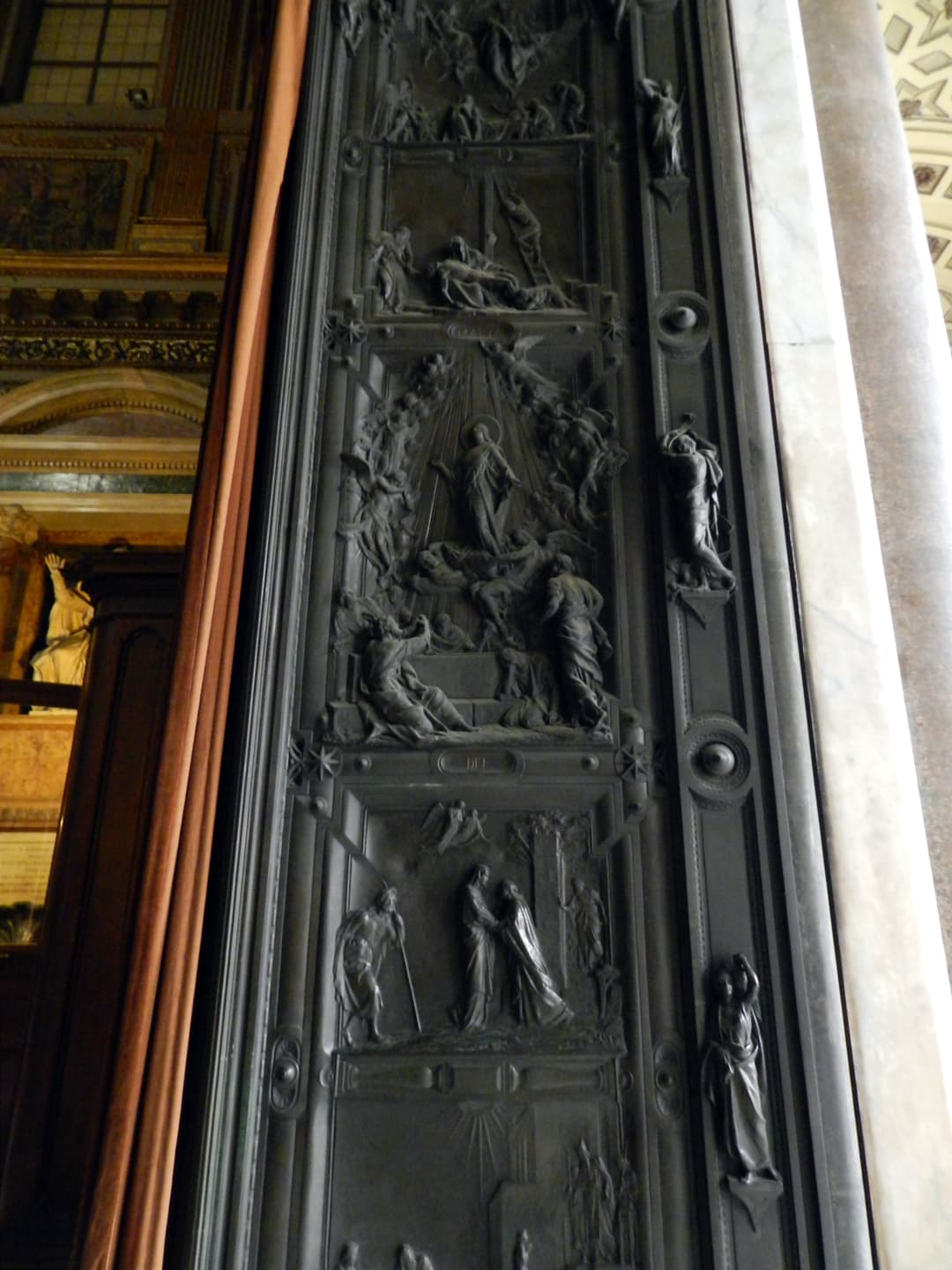Detail of the sculpted bronze entrance door of Santa Maria Maggiore.