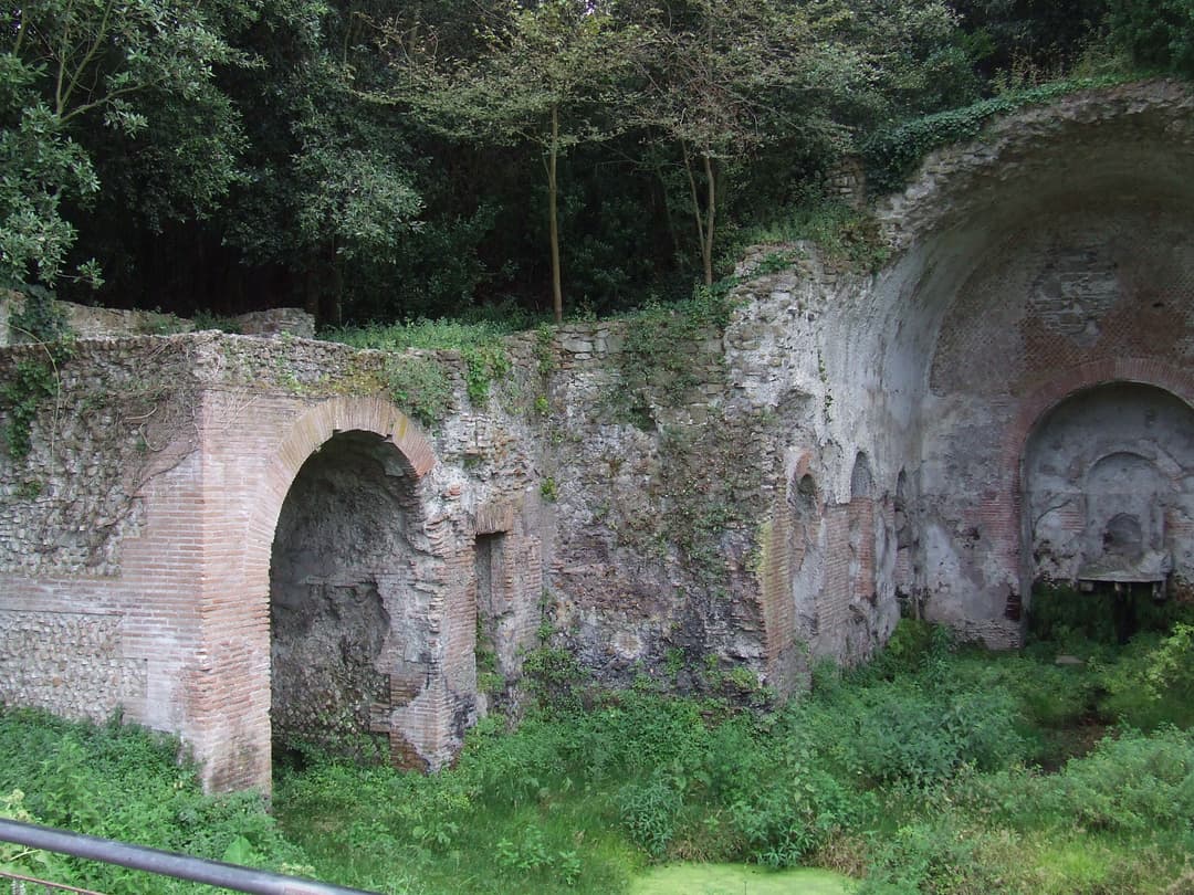 The Nymphaeum surrounded by lush greenery.