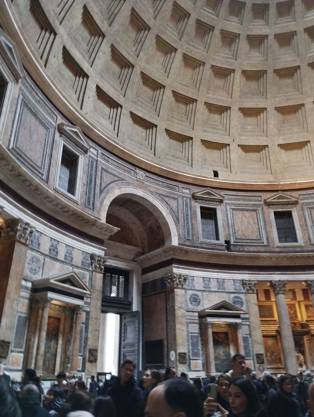 Interior of the Pantheon showing its coffered dome and marble-clad drum.