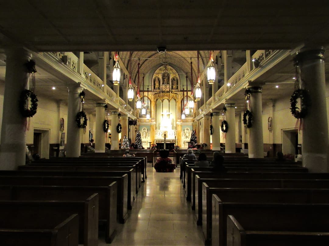 Interior view of the nave and altar decorated for Christmas