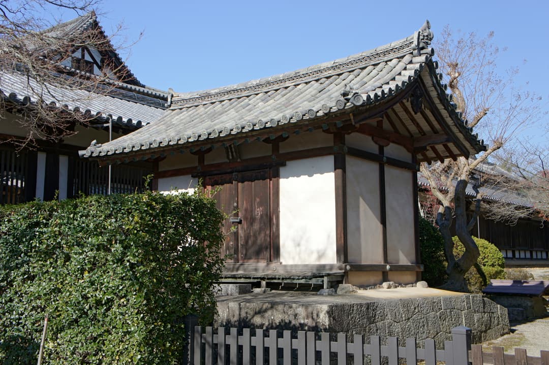 Exterior of a traditional tiled outbuilding at Hōryū-ji in daytime