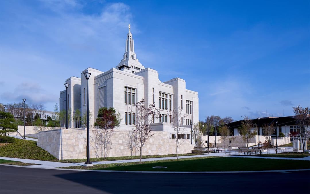 Daytime exterior view of the Sapporo Japan Temple and landscaped grounds.