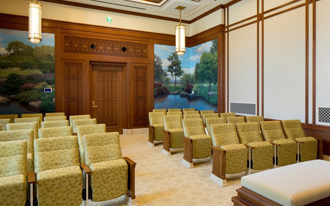 Interior seating room with landscape murals in the Sapporo Japan Temple.