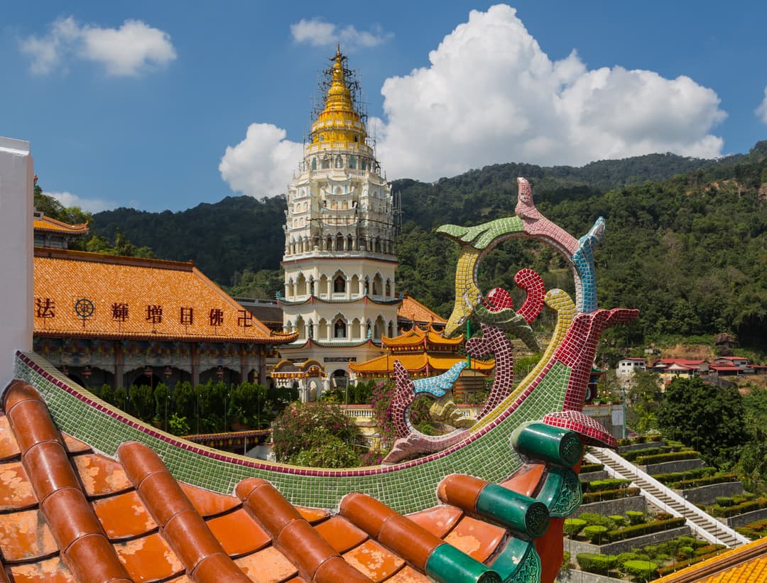 Ornate mosaic roof detail and the Pagoda of Ten Thousand Buddhas at Kek Lok Si.