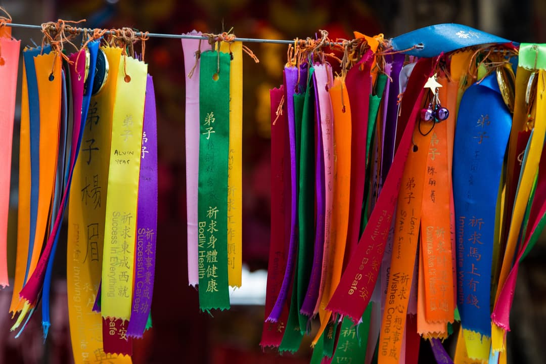 Colorful prayer ribbons inscribed with wishes at Kek Lok Si Temple.