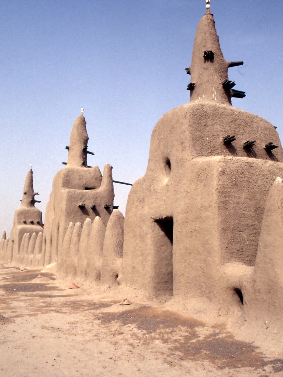 Rooftop view of earthen towers and spires topped with ostrich eggs