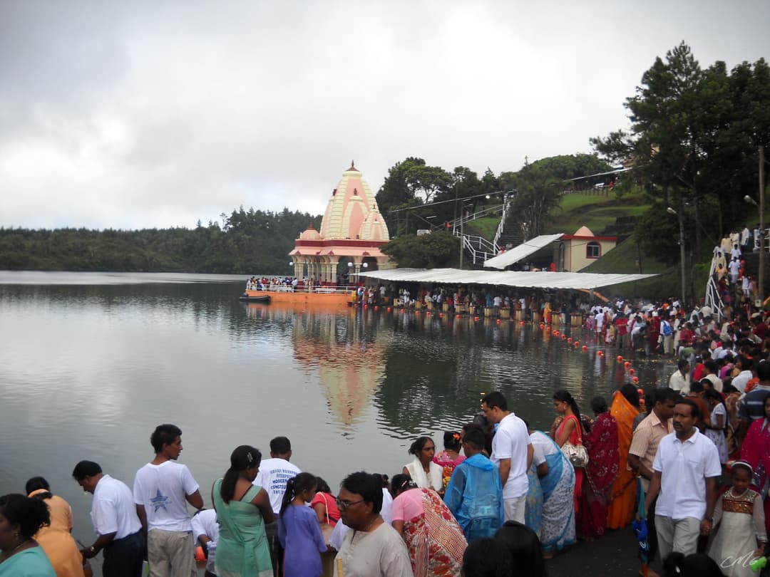 Pilgrims gathered along the shores of Ganga Talao by the lakeside temple.