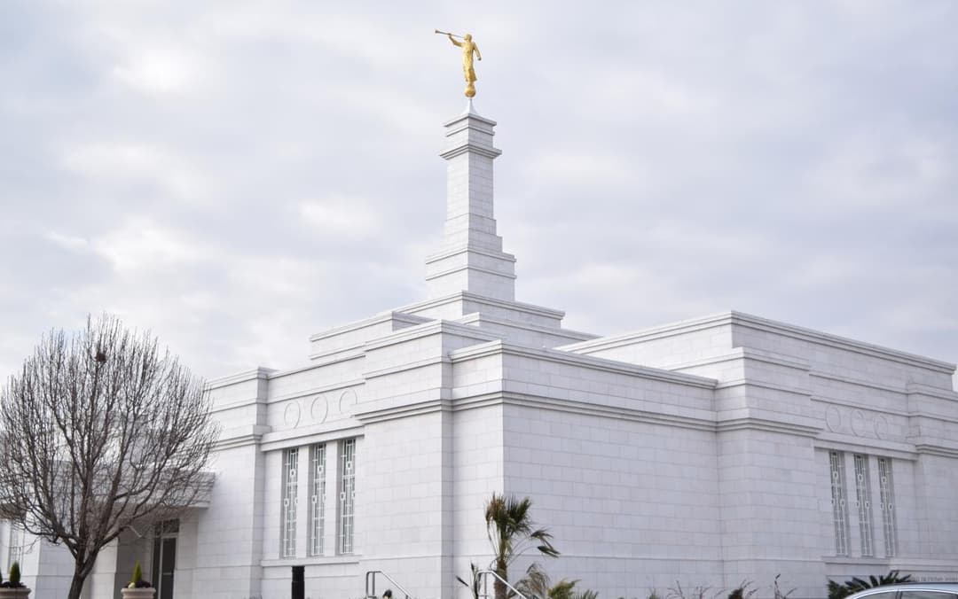 Ciudad Juárez Mexico Temple exterior and spire under overcast skies.