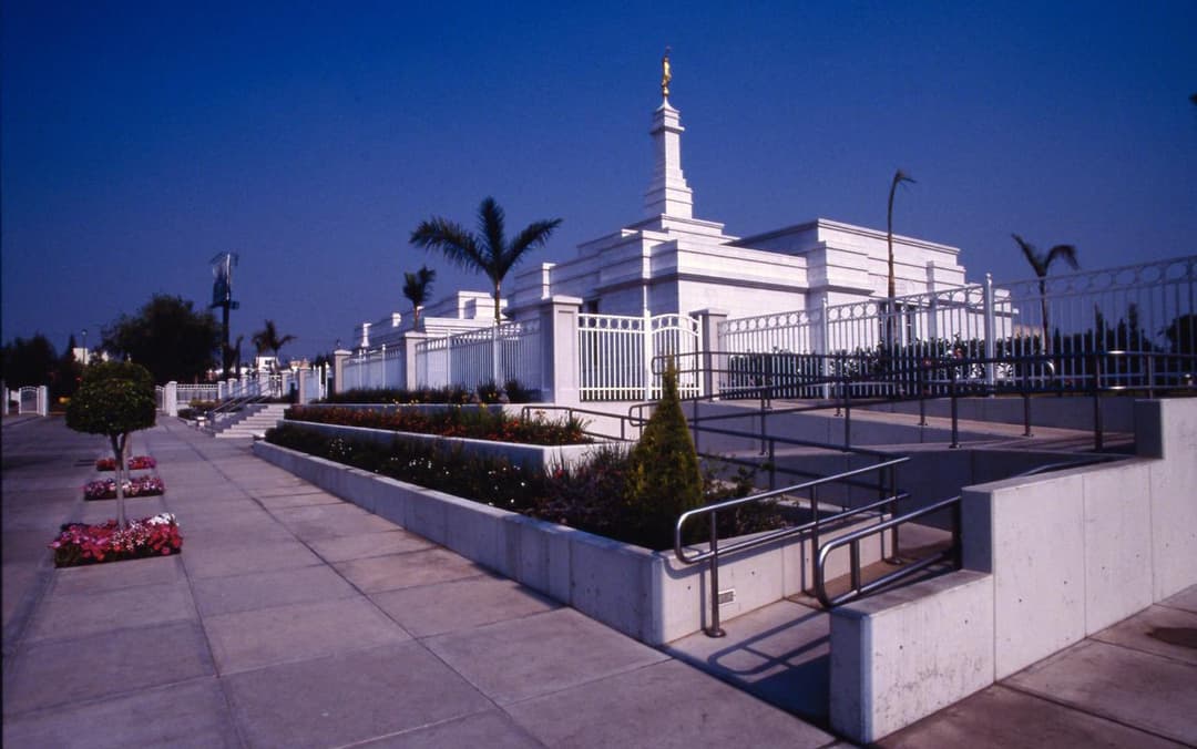 Guadalajara Mexico Temple exterior, grounds with ramp, planters, and spire.