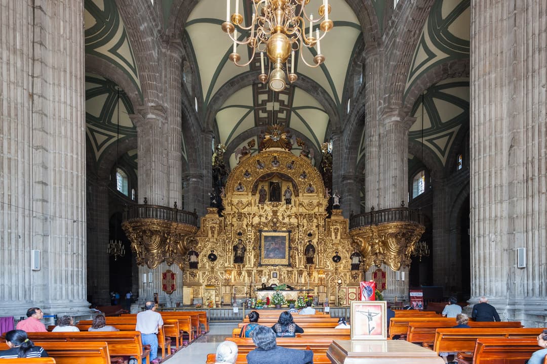 Interior view of Mexico City Metropolitan Cathedral showing the golden altar.