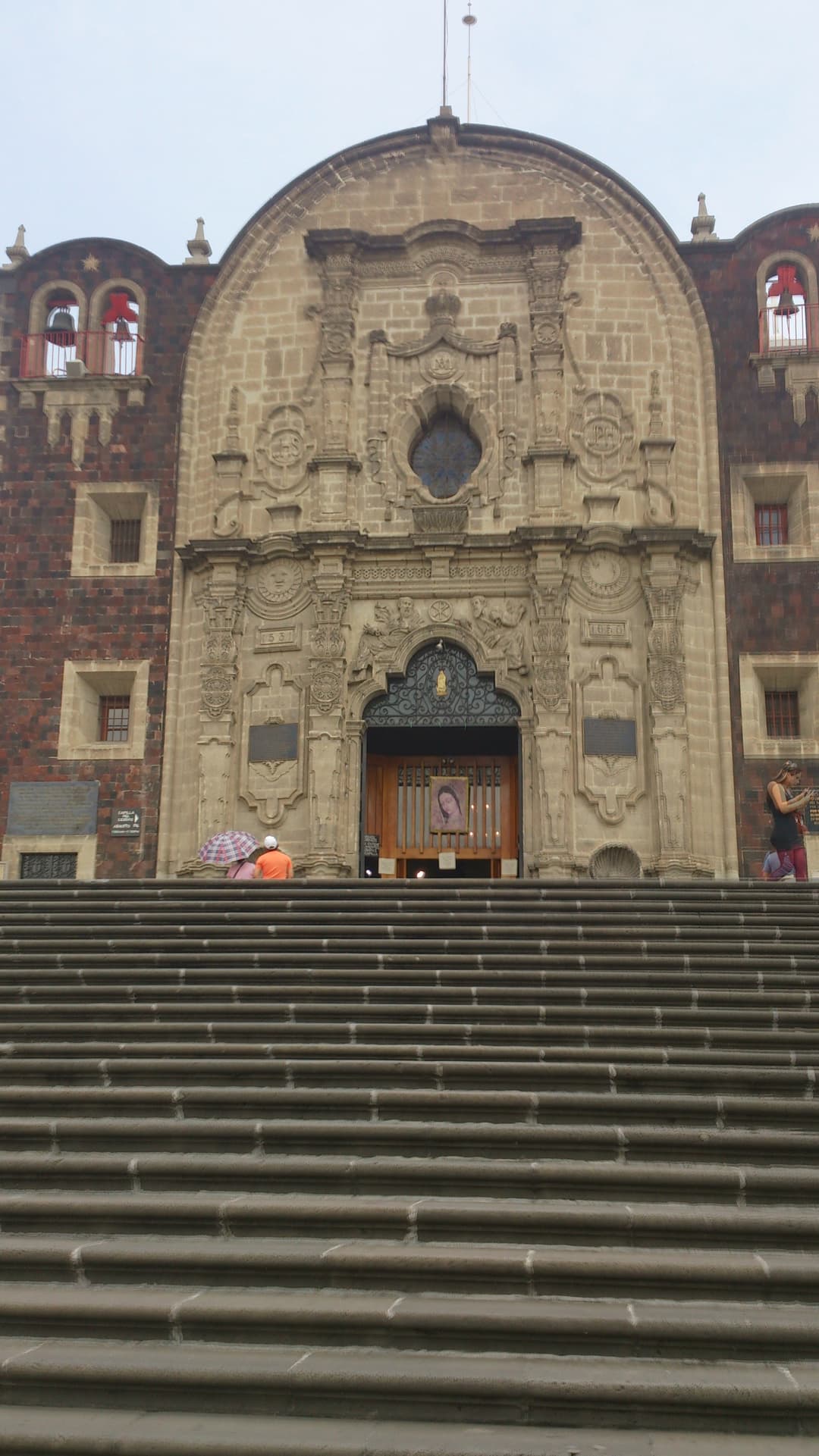 Low-angle view of the Capilla del Cerrito facade and front stone steps.