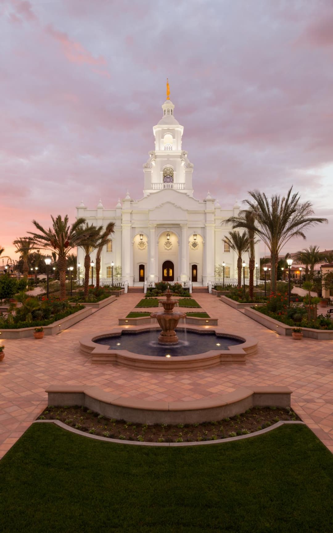 Front entrance and fountain of the Tijuana Mexico Temple at twilight.